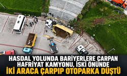 Hasdal yolunda bariyerlere çarpan hafriyat kamyonu, İSKİ önünde iki araca çarpıp otoparka düştü